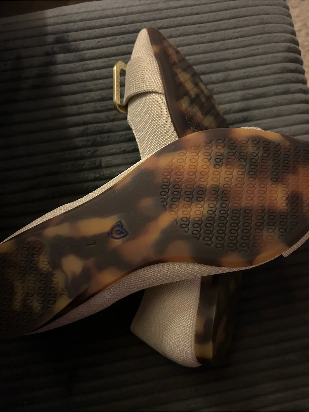 Rothy's “The Emblem Point II” pointed flats with gold hardware